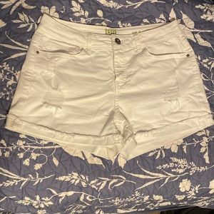 White ripped shorts